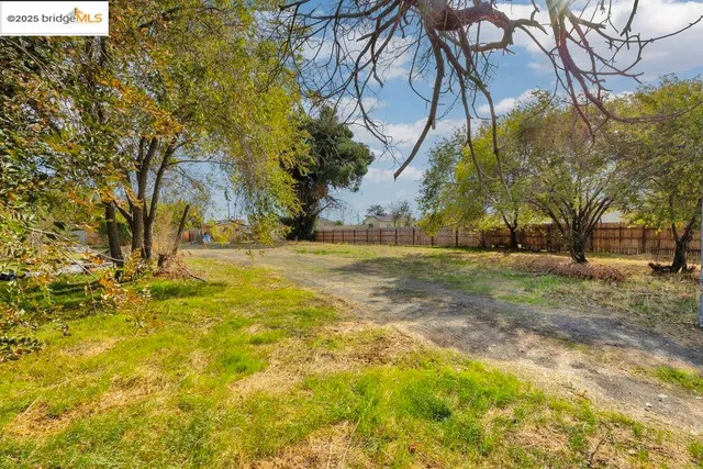 an aerial view of residential houses and outdoor space