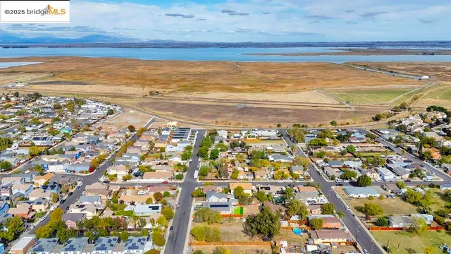 an aerial view of a residential houses and city view