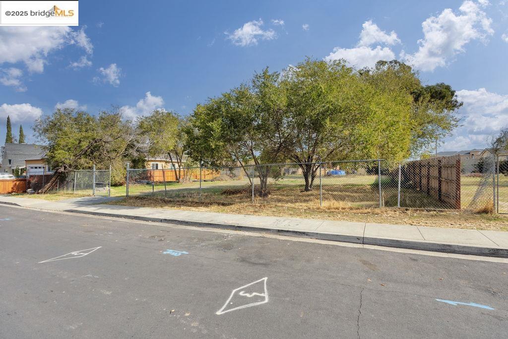 64 South Bella Monte Avenue Bay Point, CA 94565 - Photo 4 of 38 a view of street along with trees