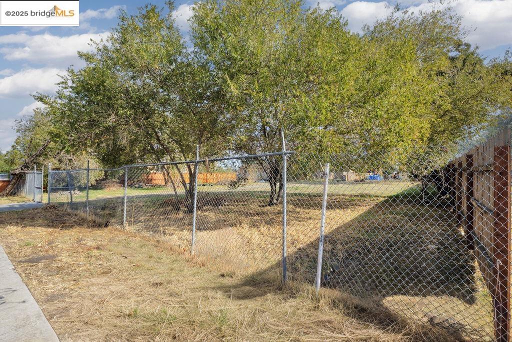 64 South Bella Monte Avenue Bay Point, CA 94565 - Photo 5 of 38 a backyard of a house with large trees