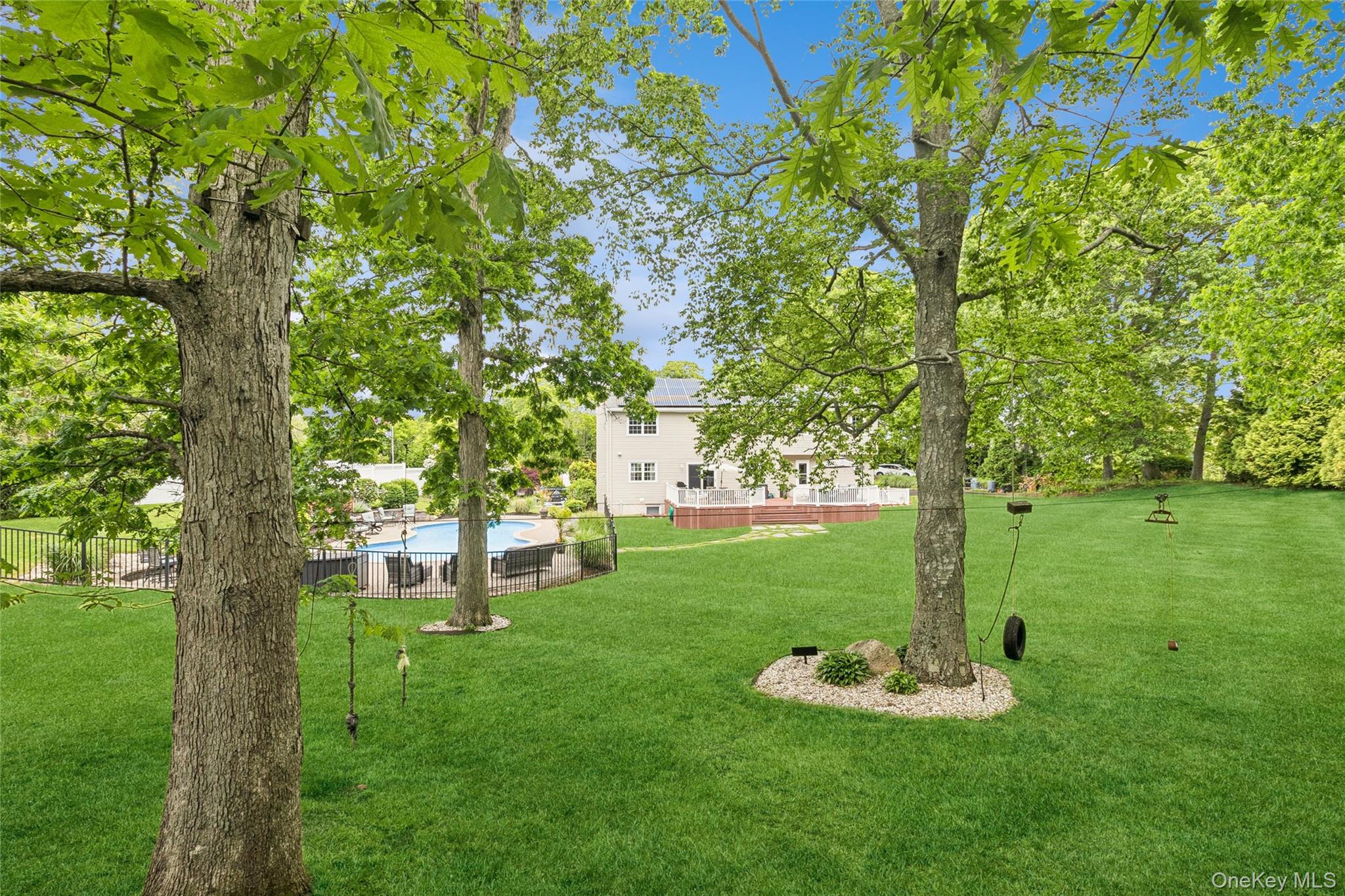 42 Adelia Path Riverhead, NY 11901 - Photo 20 of 30 Back yard featuring playful swings