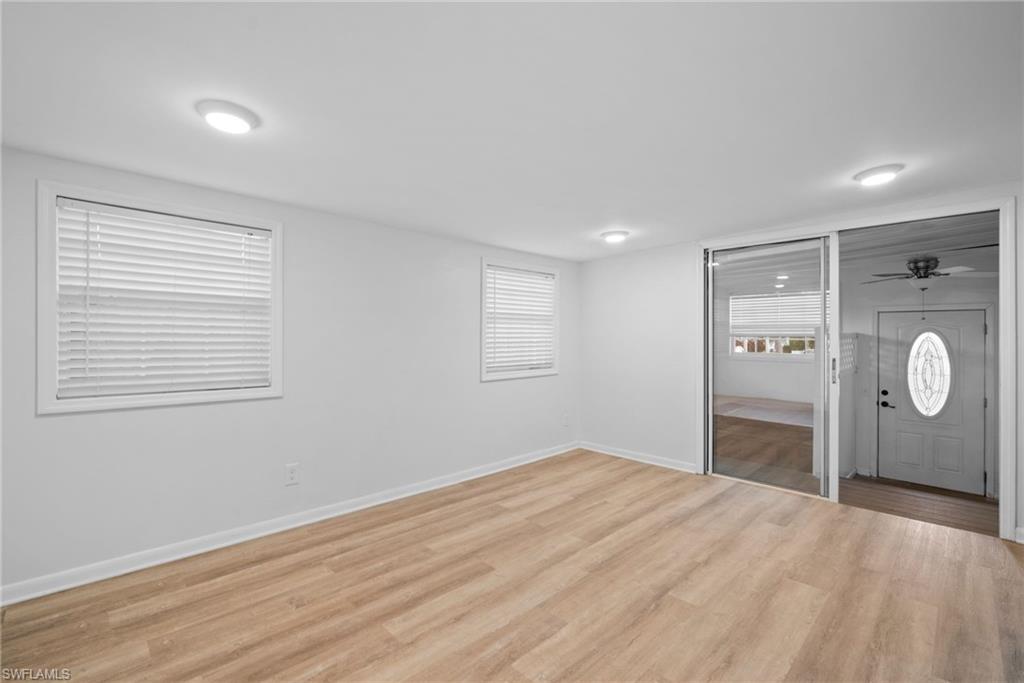 26222 Earl Road Bonita Springs, FL 34135 - Photo 4 of 23 a bedroom with a bed and a window