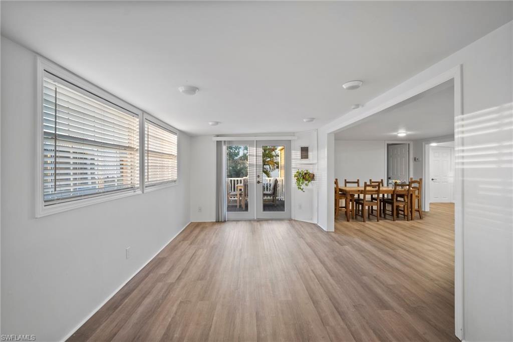 26222 Earl Road Bonita Springs, FL 34135 - Photo 7 of 23 a view of a livingroom with wooden floor