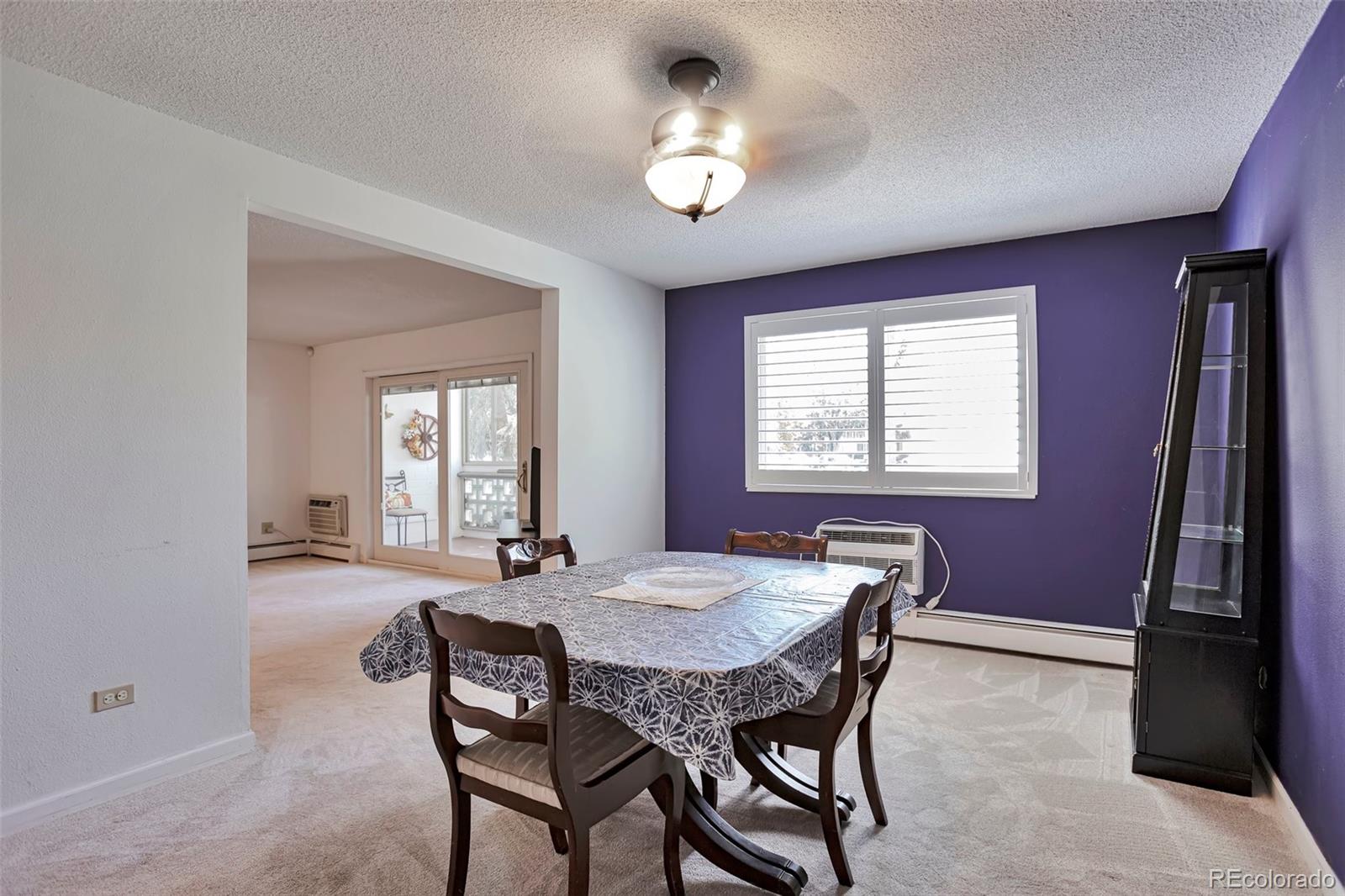 650 South Clinton Street, Unit 3A Denver, CO 80247 - Photo 21 of 25 a dining room with furniture and window