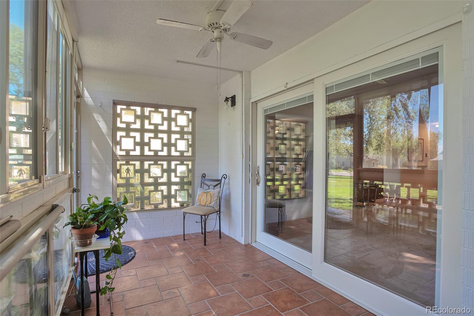 650 South Clinton Street, Unit 3A Denver, CO 80247 - Photo 24 of 25 a living room with furniture and a floor to ceiling window