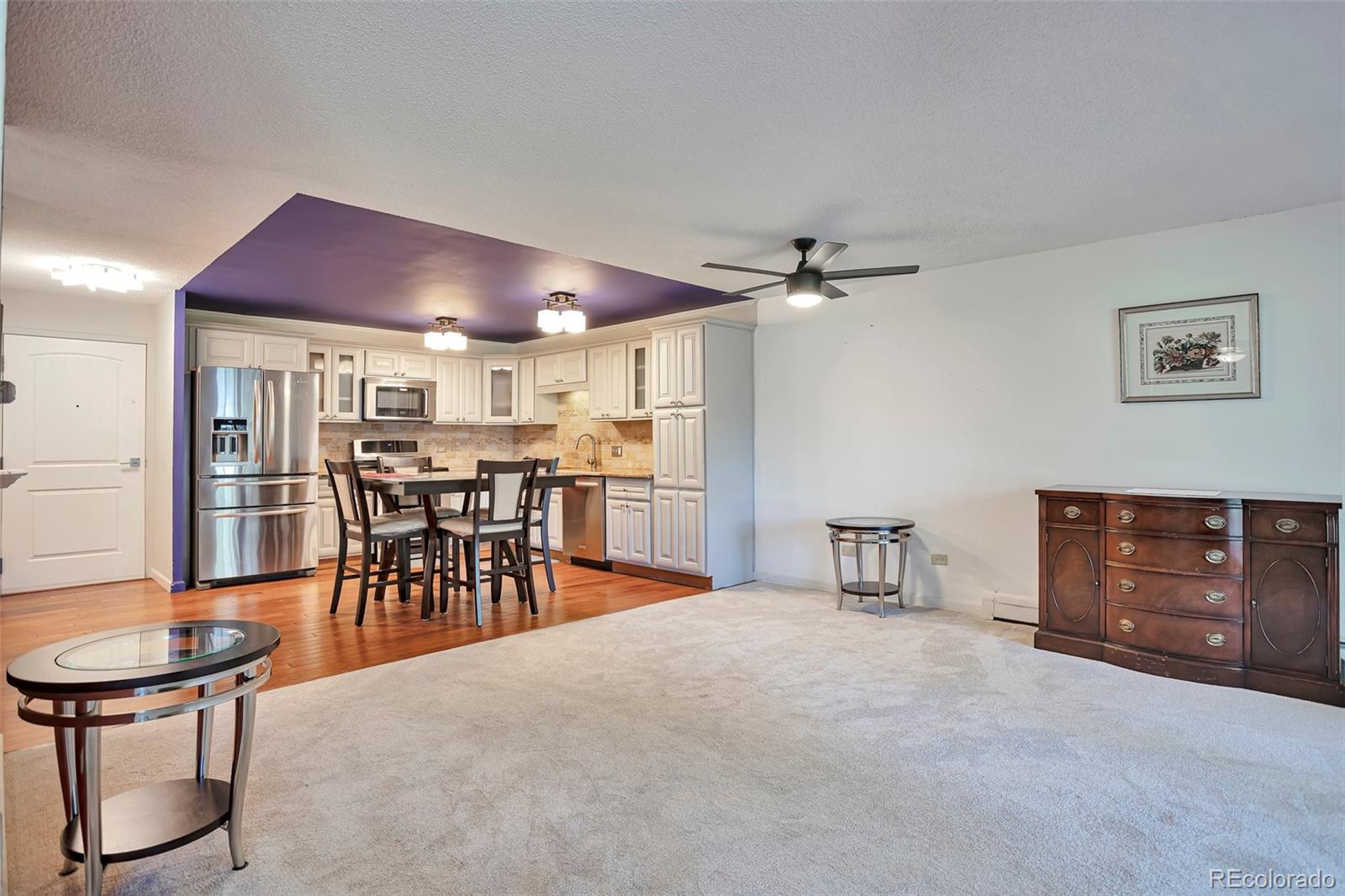 650 South Clinton Street, Unit 3A Denver, CO 80247 - Photo 6 of 25 a dining room with furniture and a livingroom