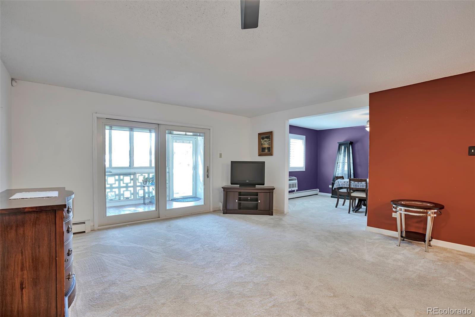 650 South Clinton Street, Unit 3A Denver, CO 80247 - Photo 10 of 25 a view of a livingroom with furniture and a window