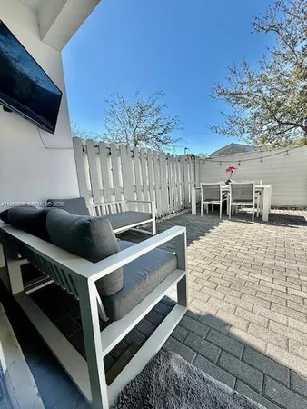 a view of balcony with furniture