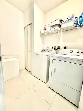 a kitchen with cabinets and appliances