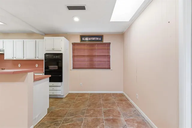 a view of kitchen and wooden floor