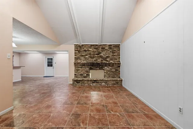 a view of an empty room and window