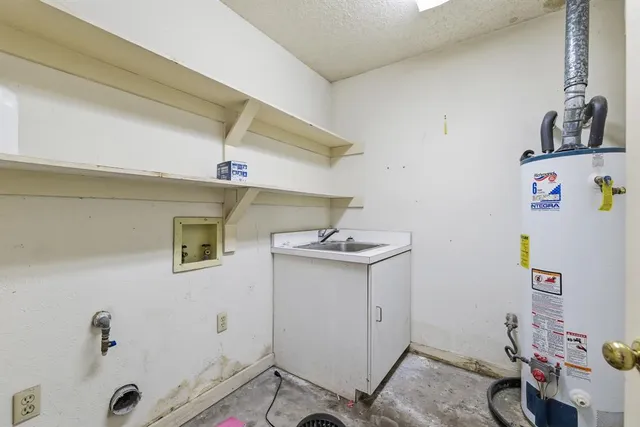a view of storage and utility room with a sink