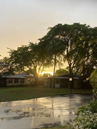 a view of a lake with chairs