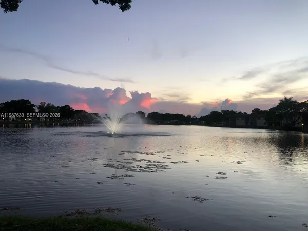 a view of a lake with a garden