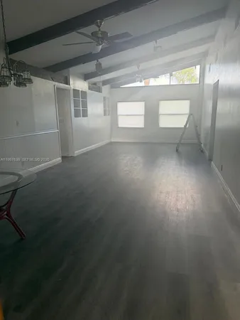 a view of empty room with windows