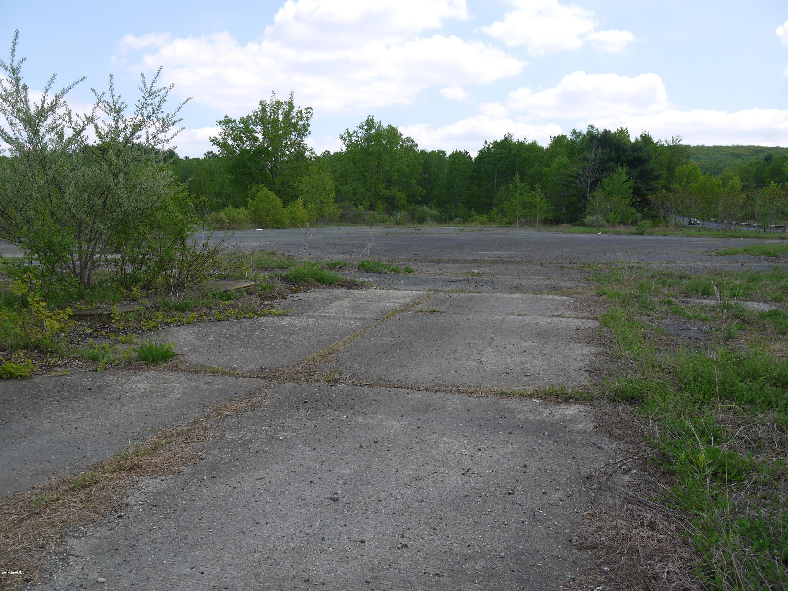 92 State Line Road West Stockbridge, MA 01266 - Photo 6 of 7 a view of a dirt road with a building in the background