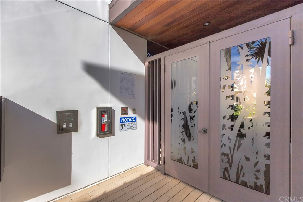 125 Hurlbut Street, Unit 101 Pasadena, CA 91105 - Photo 37 of 53 a view of a hallway with wooden floor and entryway