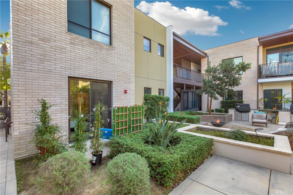 125 Hurlbut Street, Unit 101 Pasadena, CA 91105 - Photo 51 of 53 a view of a house with backyard outdoor seating and plants