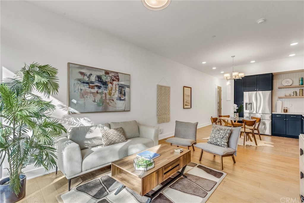 125 Hurlbut Street, Unit 101 Pasadena, CA 91105 - Photo 8 of 53 a living room with furniture and wooden floor