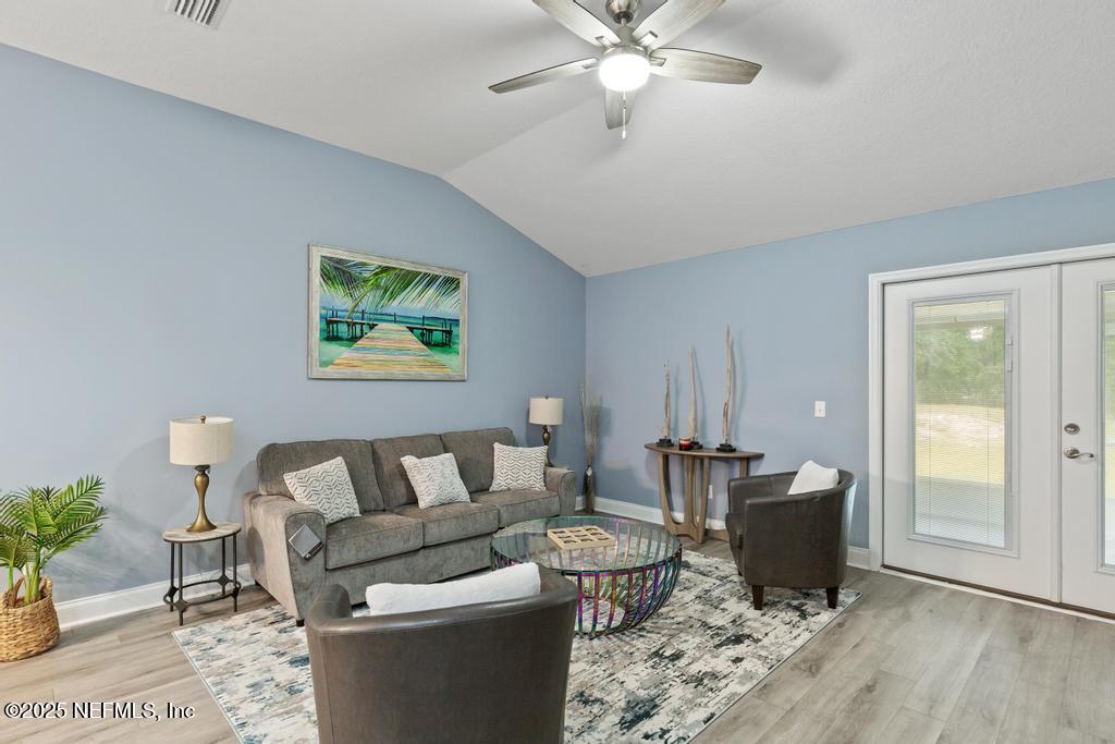 54174 Deerfield Country Club Road Callahan, FL 32011 - Photo 17 of 36 a living room with furniture and a window