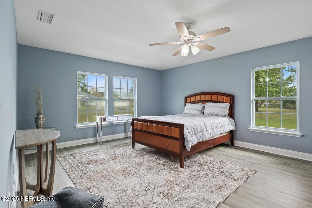 54174 Deerfield Country Club Road Callahan, FL 32011 - Photo 21 of 36 a bedroom with a bed and window
