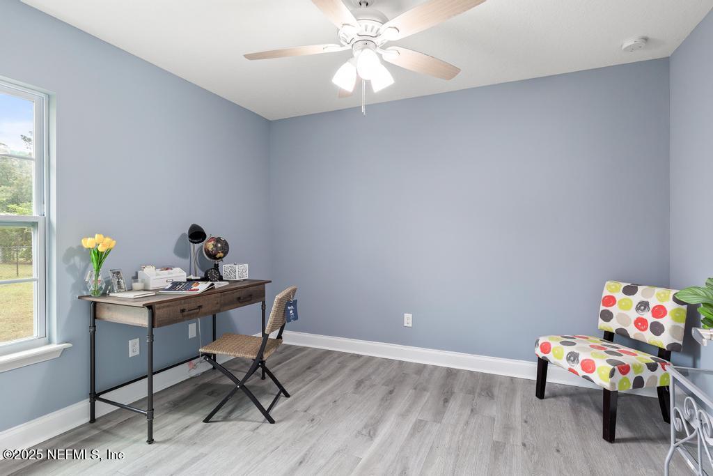 54174 Deerfield Country Club Road Callahan, FL 32011 - Photo 24 of 36 a reading room with furniture and a window