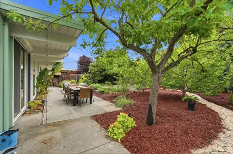 a view of outdoor dining space with a patio