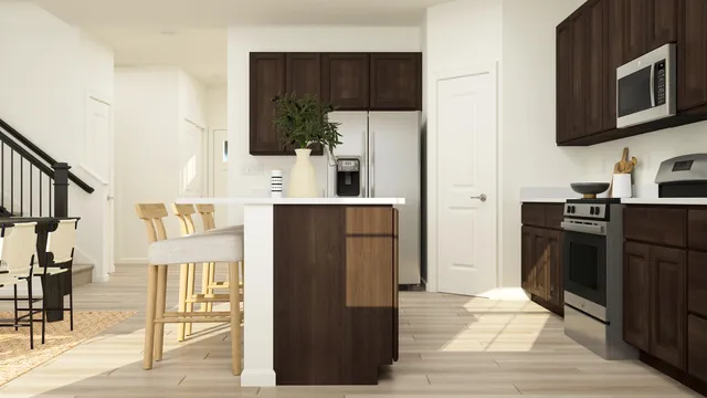 a kitchen with stainless steel appliances a refrigerator and a stove top oven