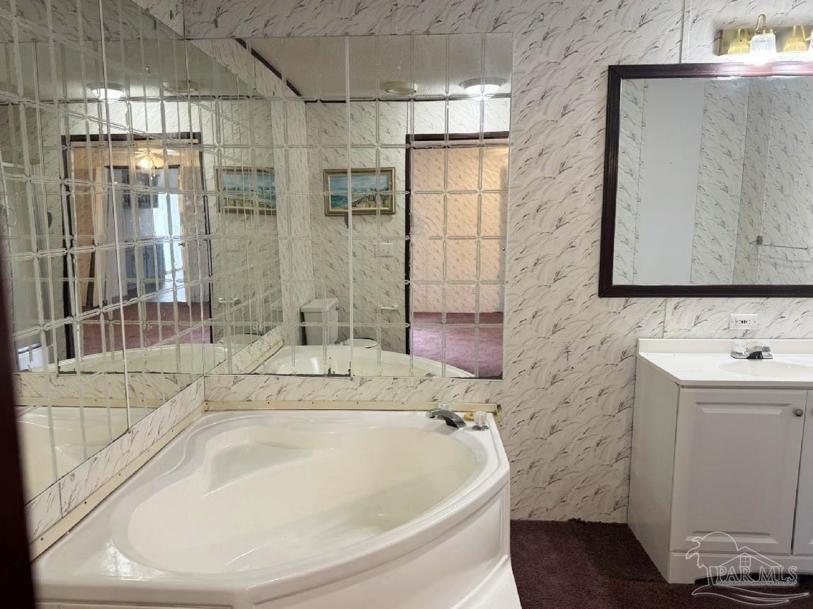 818 Twin Bridges Road Flomaton, AL 36441 - Photo 12 of 33 a bath tub sitting next to a bathroom sink