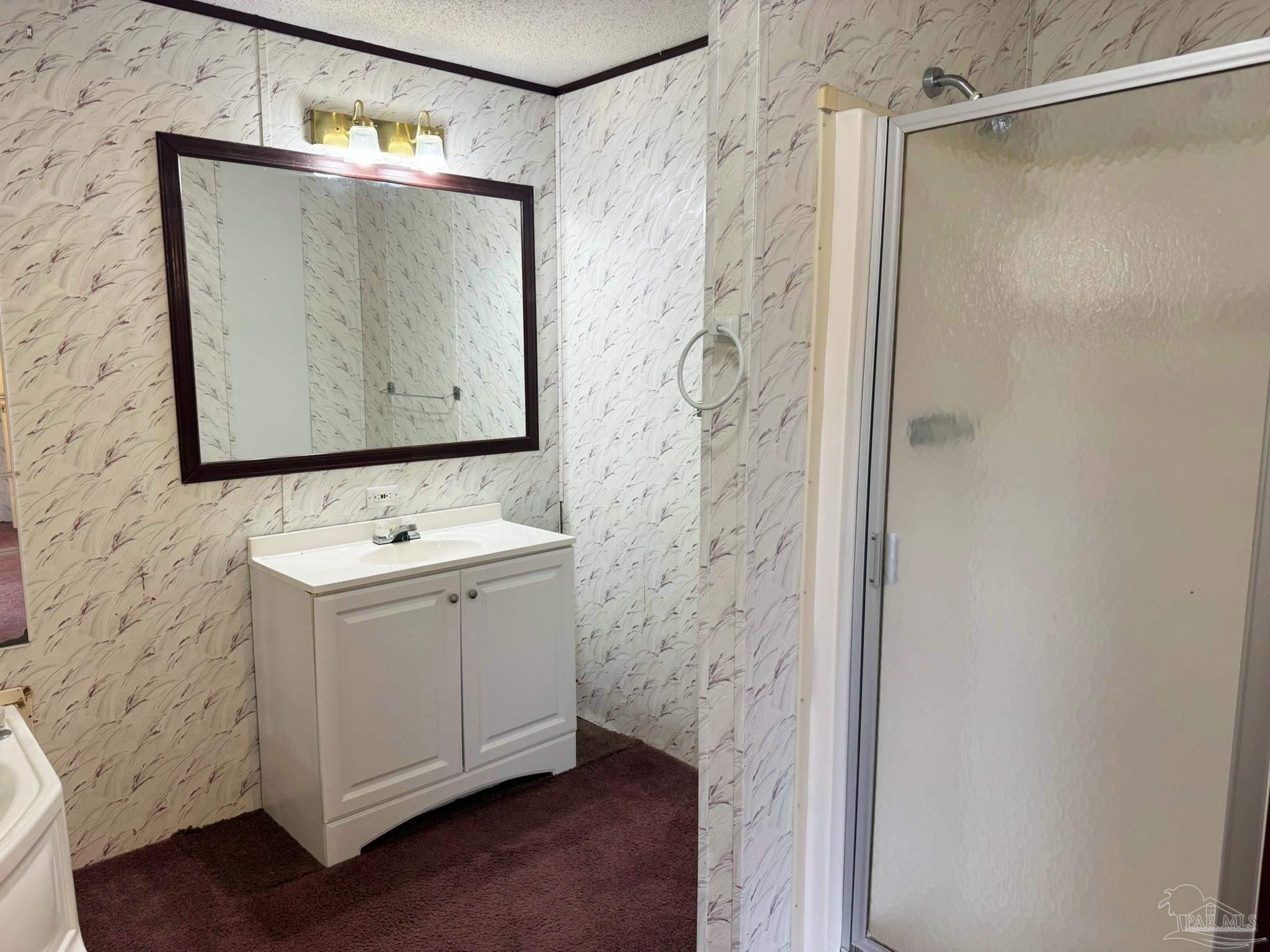 818 Twin Bridges Road Flomaton, AL 36441 - Photo 13 of 33 a bathroom with a sink and mirror