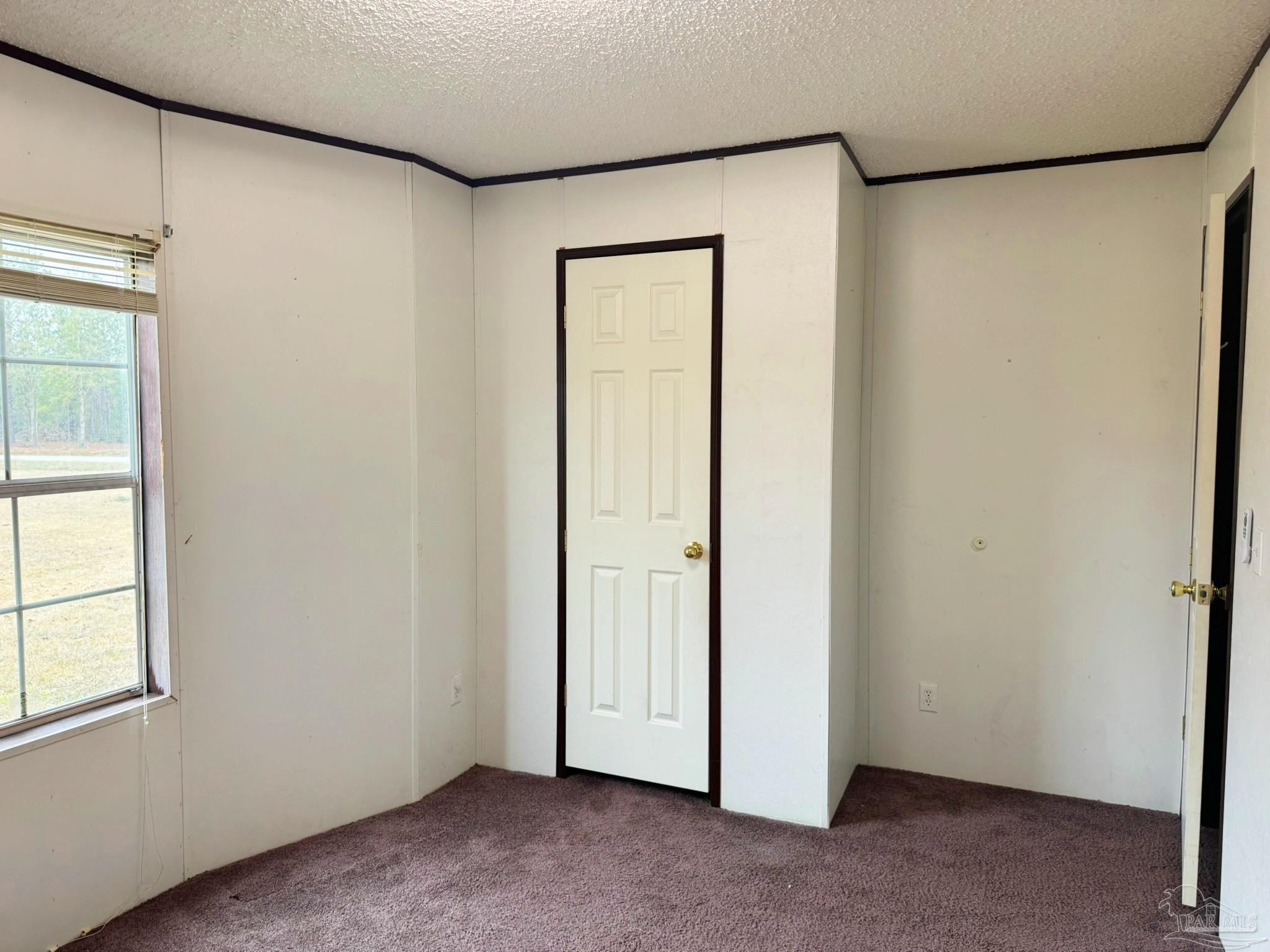 818 Twin Bridges Road Flomaton, AL 36441 - Photo 18 of 33 an empty room with windows