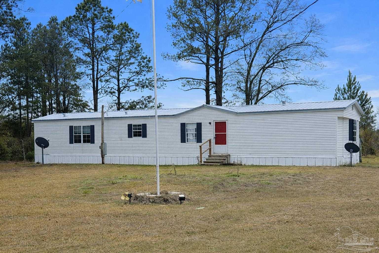 818 Twin Bridges Road Flomaton, AL 36441 - Photo 21 of 33 a view of a house with a yard