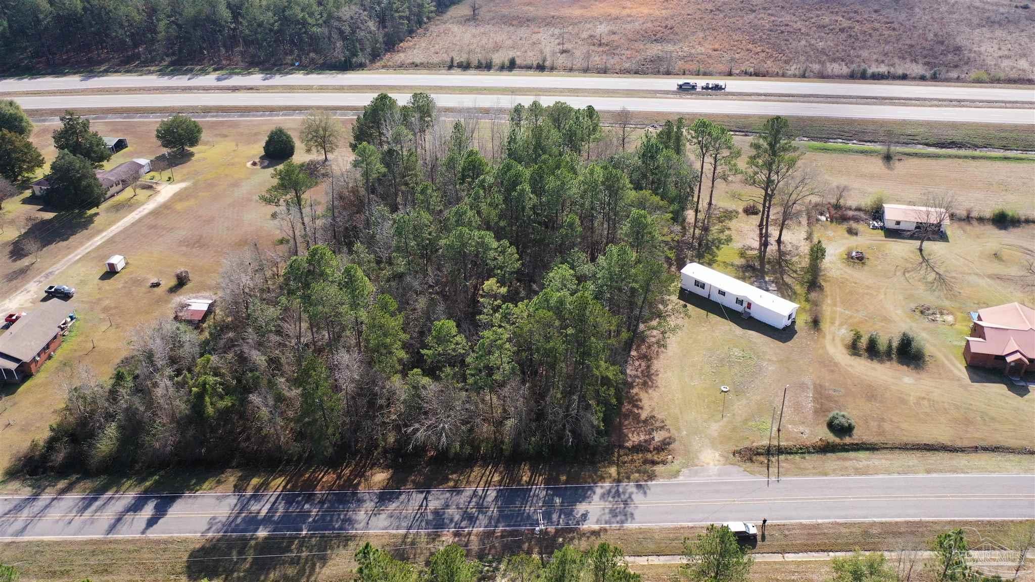 818 Twin Bridges Road Flomaton, AL 36441 - Photo 31 of 33 a view of a water pond with sitting area