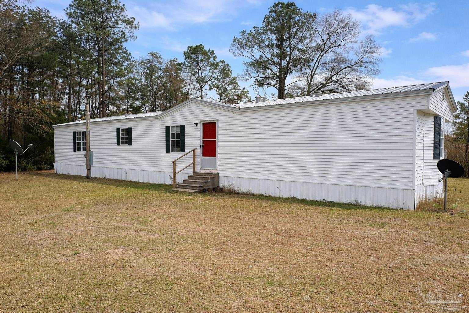 818 Twin Bridges Road Flomaton, AL 36441 - Photo 5 of 33 a view of a backyard with a garden