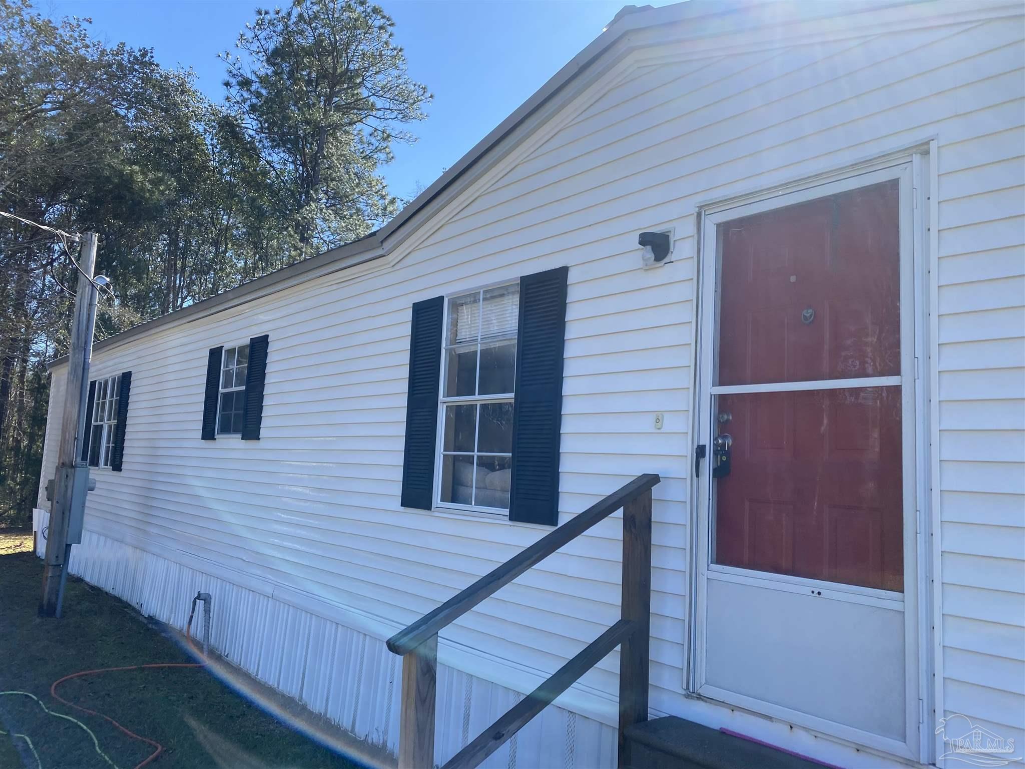 818 Twin Bridges Road Flomaton, AL 36441 - Photo 6 of 33 a view of a house with a deck