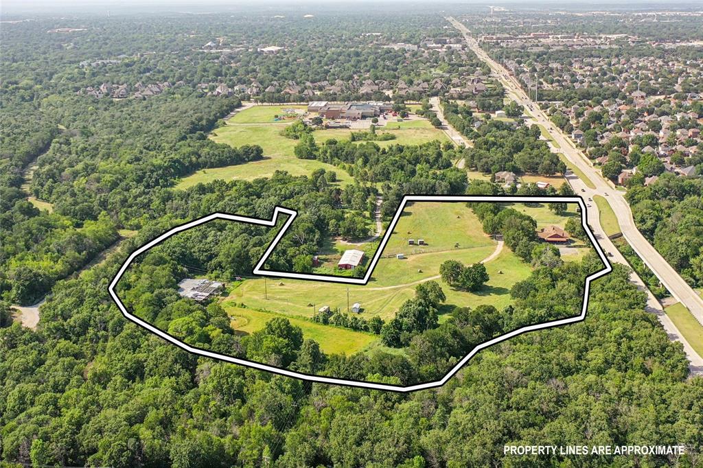3030 Wager Road Flower Mound, TX 75028 - Photo 1 of 40 Expansive aerial view showcasing a large land parcel with mature trees and open grassy areas