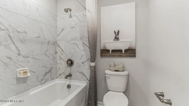 a bathroom with a sink a toilet and a bathtub