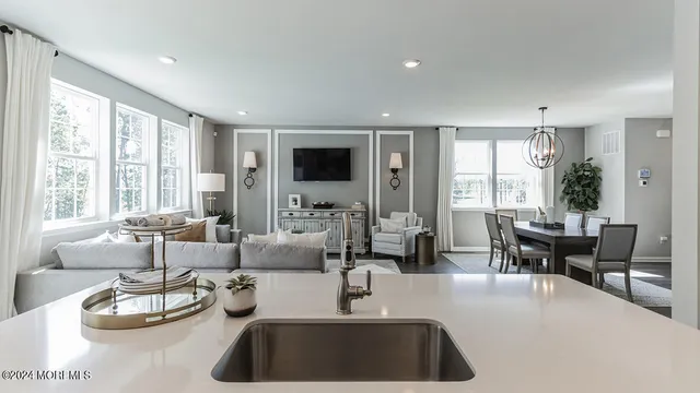 a kitchen with a table chairs and couches