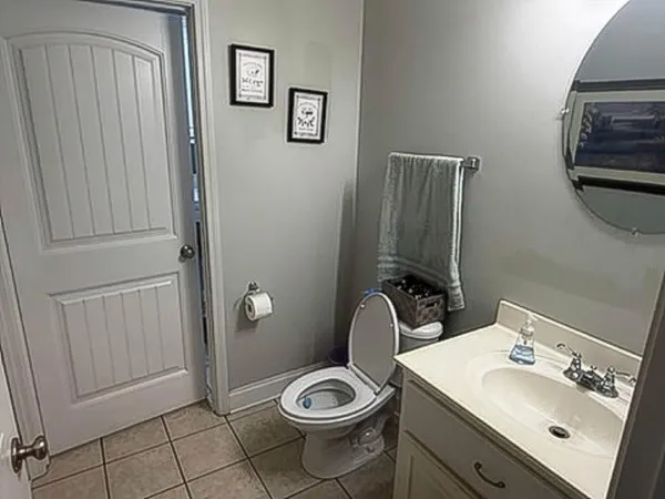 a bathroom with a sink toilet and vanity