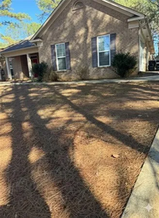 a view of a yard in front of a house