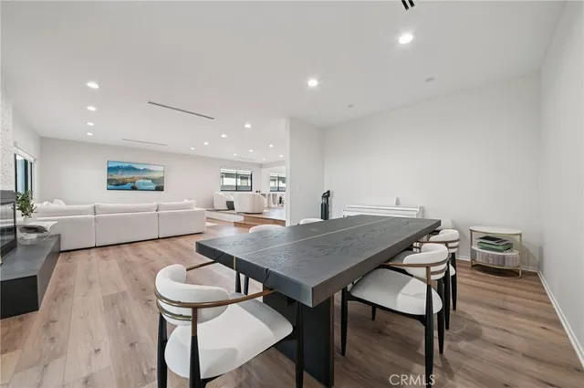 a living room with a table and chairs