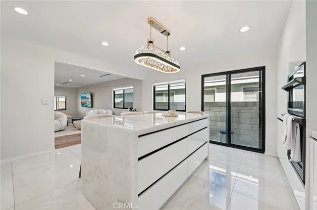 a view of living room with granite countertop furniture and a flat screen tv