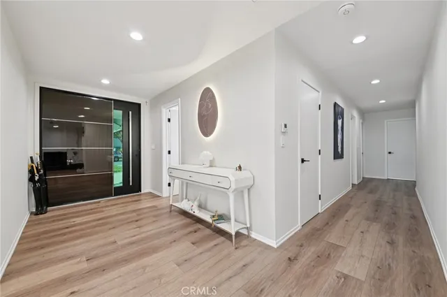 a spacious bathroom with a double vanity sink and a mirror