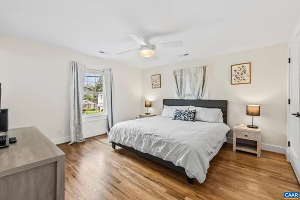 a bedroom with a bed and a desk