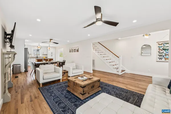 a living room with furniture and a rug