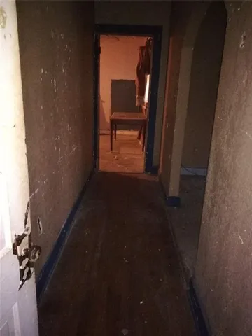 a large kitchen with stainless steel appliances kitchen island granite countertop a sink and cabinets