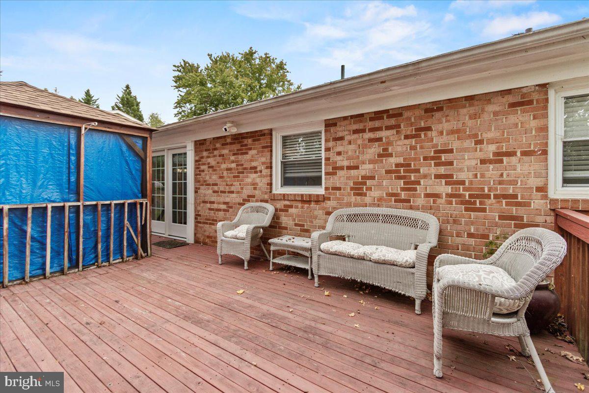 517 Round Table Drive Fort Washington, MD 20744 - Photo 21 of 25 a balcony with furniture and a wooden floor