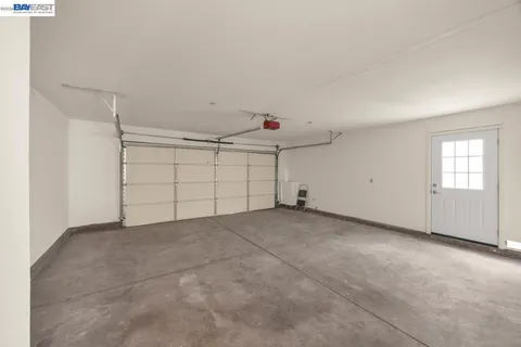 a view of a patio with couple of chairs and couch