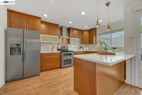 a kitchen with a stove and cabinets