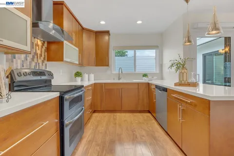 a living room with a table and a mirror